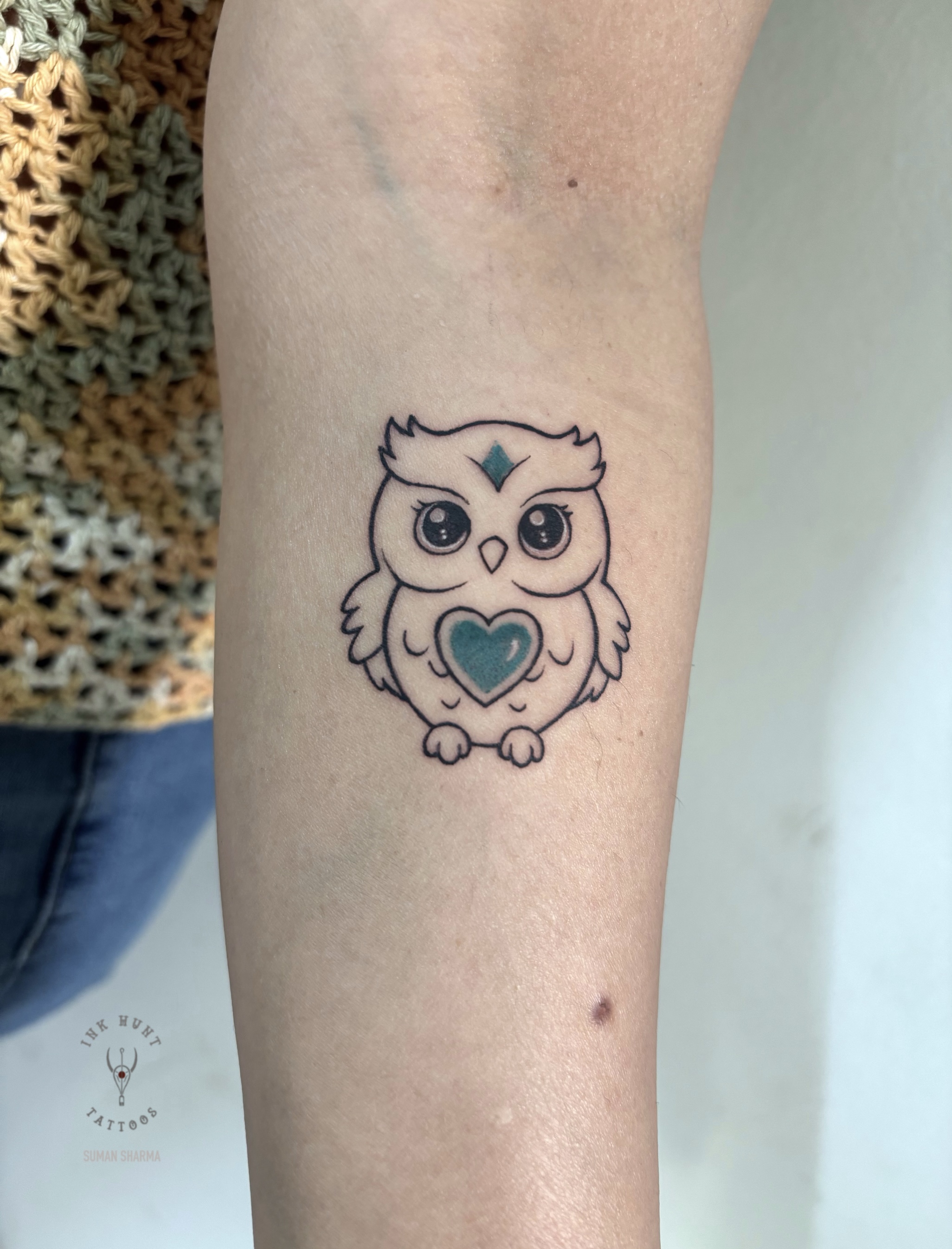 Minimalist owl tattoo