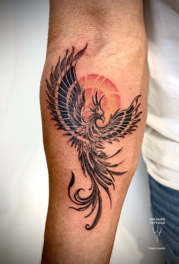 Watercolor phoenix and sun tattoo